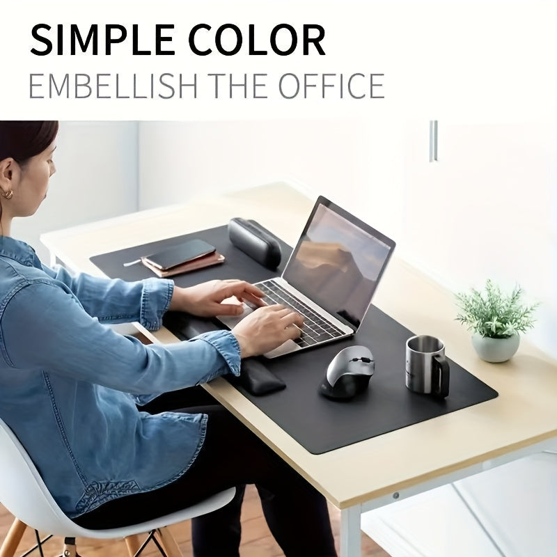 Black non-slip desk mat for office, ideal for computer and mouse.