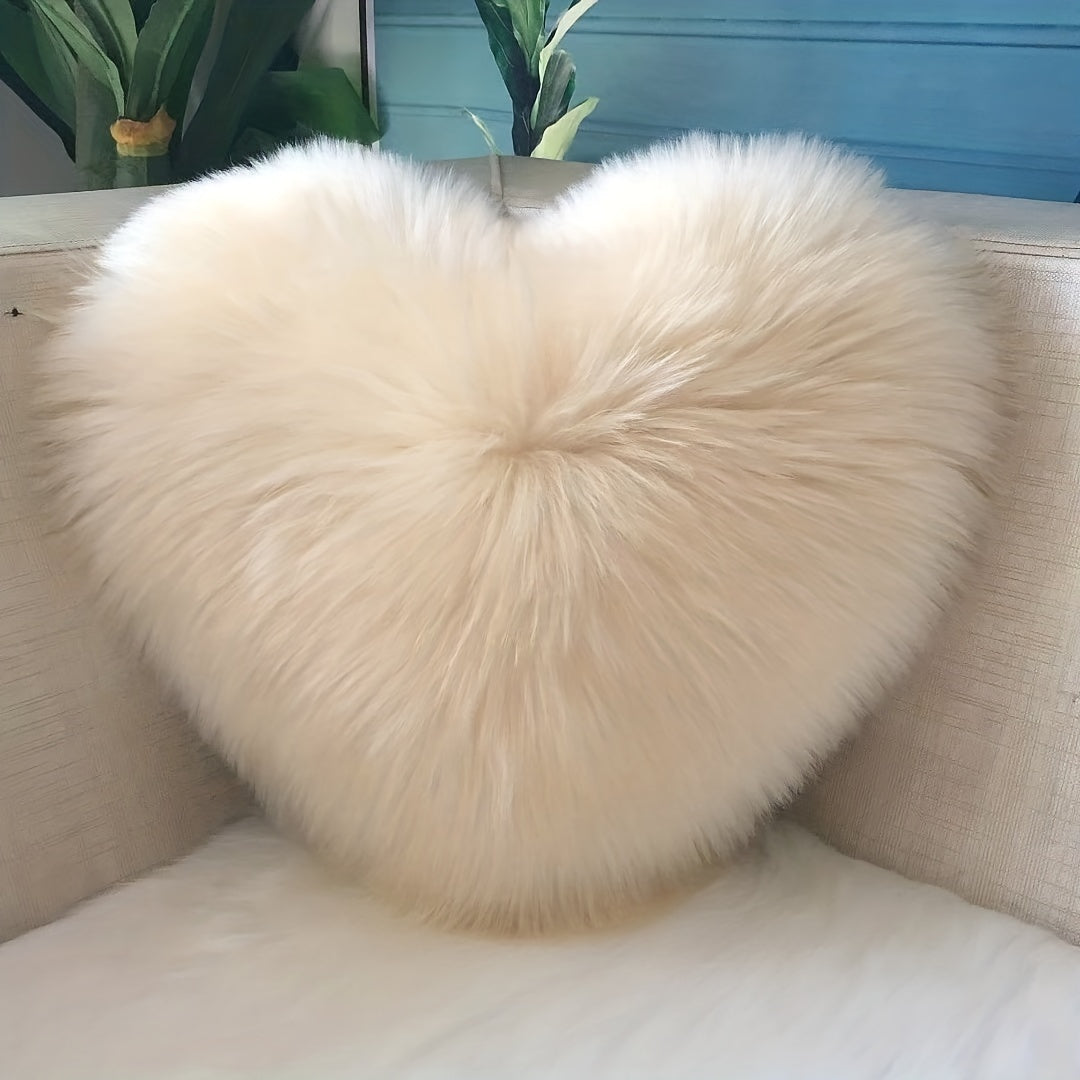 Heart-shaped throw pillow for living room or bedroom, made of long plush material for softness and comfort.