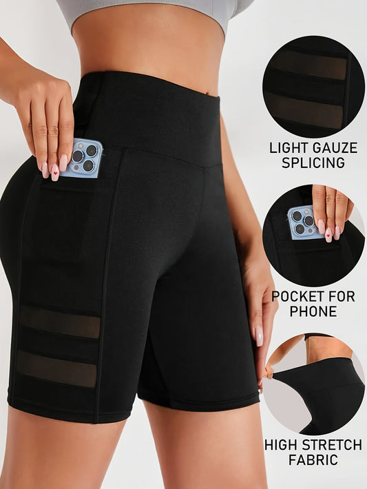 Stretchy high-waist cycling shorts with side pockets, mesh panels for breathability, and moisture-wicking technology for fitness and sports.