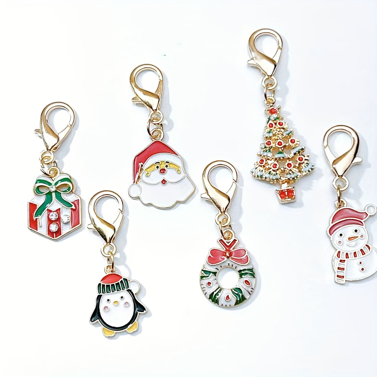 Six Christmas keychain charms made of zinc alloy with festive keyrings. These non-plated metal bag pendants are simple in style and perfect as holiday gifts for friends.