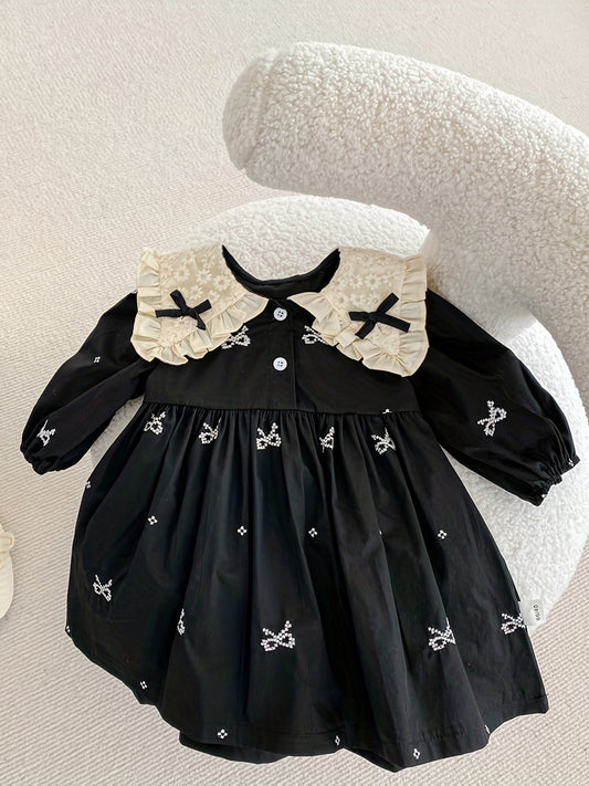 Floral print black dress for girls with butterfly bow and ruffled collar. Cotton, loose fit, spring wear, ideal for outdoor activities.