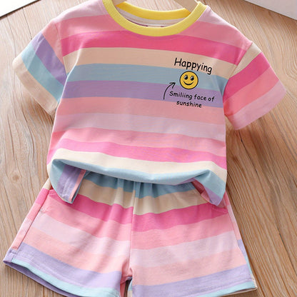 Summer fashion set for girls: Cute T-shirt with joyful face & letter print paired with striped shorts. Made of cotton blend, machine washable, ideal for outdoor activities.