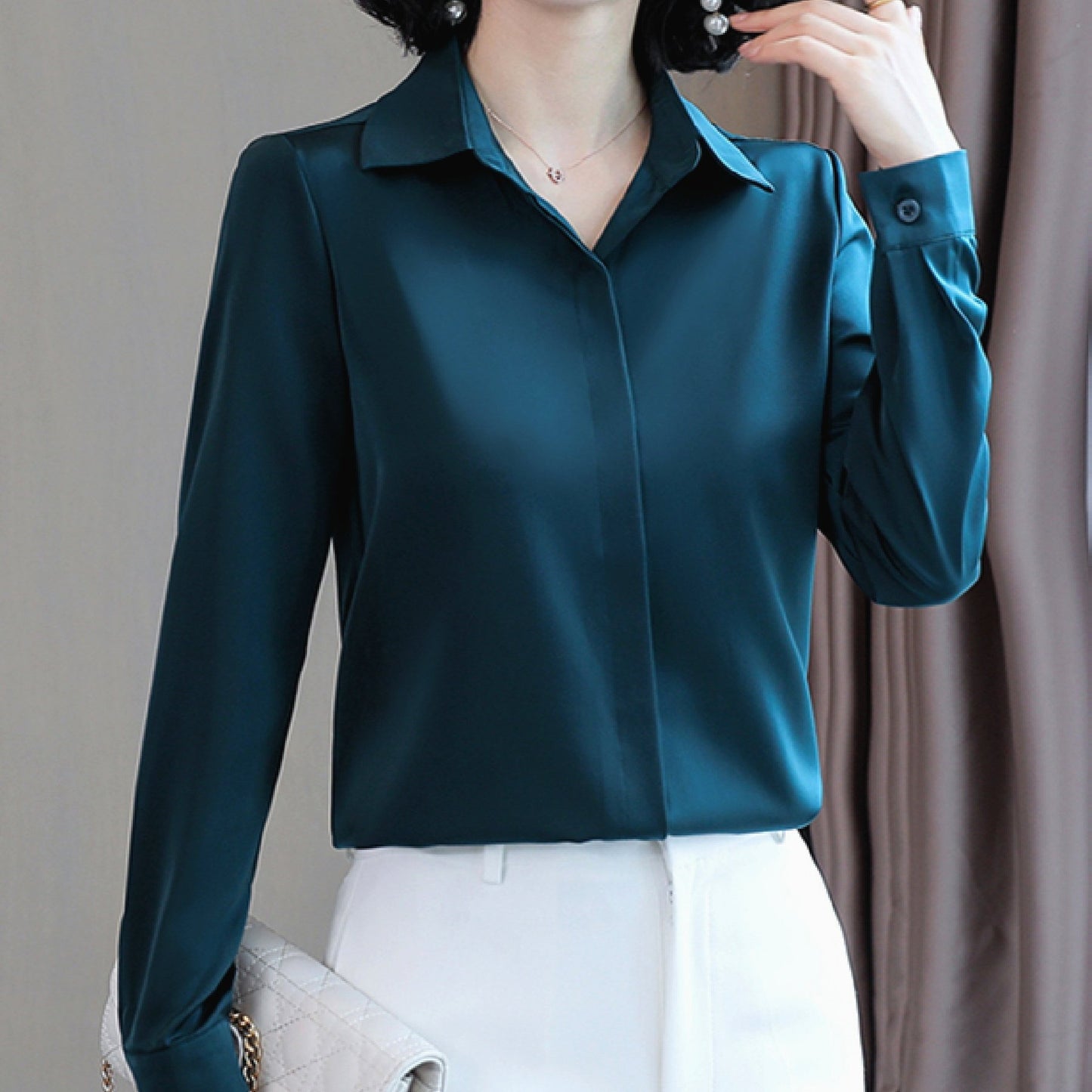 Long sleeve satin shirt with solid color, collared button-up design for women. Machine washable and perfect for spring/fall. Ideal for sophisticated adults with luxurious style.