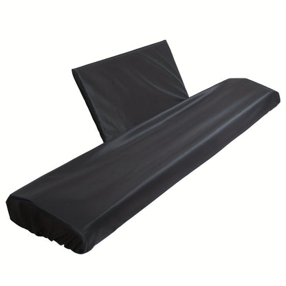 Black polyester dust cover for 88-key digital pianos with washable material, snug fit, and drawstring closure. Includes music sheet stand. Compatible with electric and digital pianos.