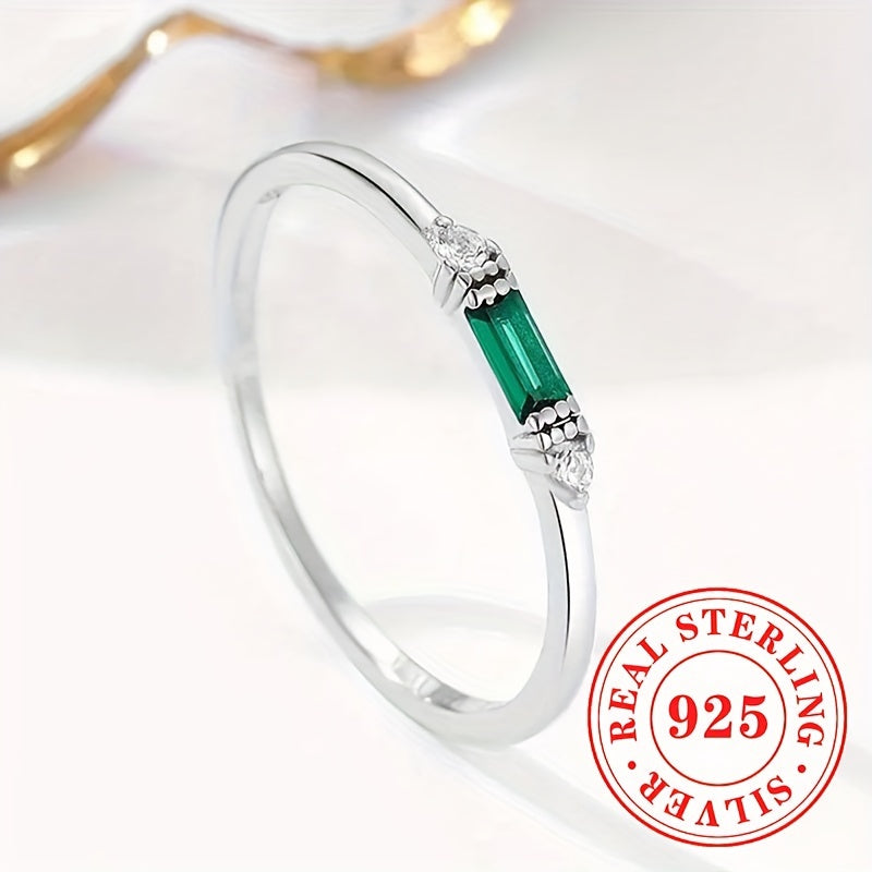 Delicate Sterling Silver Ring adorned with Baguette Cubic Zirconia and a Synthetic Green Gemstone, perfect for everyday wear or special occasions. This elegant piece is suitable for stacking and makes a thoughtful gift for women.