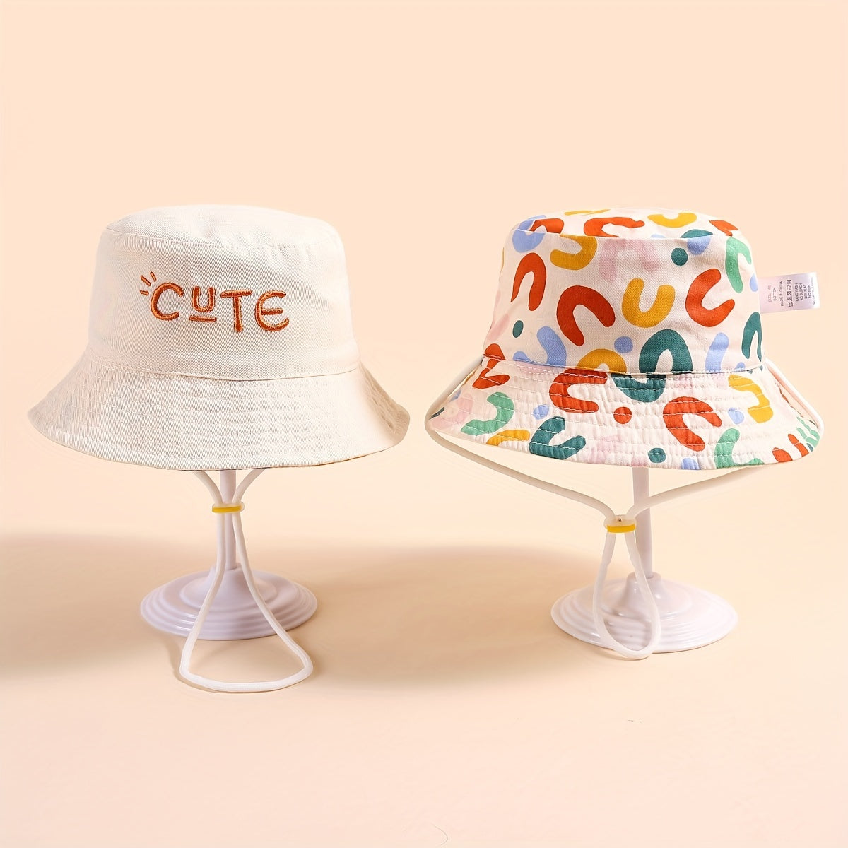 Stylish fisherman hat with cute letter embroidery, wide brim and drawstrings for sun protection and outdoor activities. Ideal for boys and girls in beach parties or traveling.