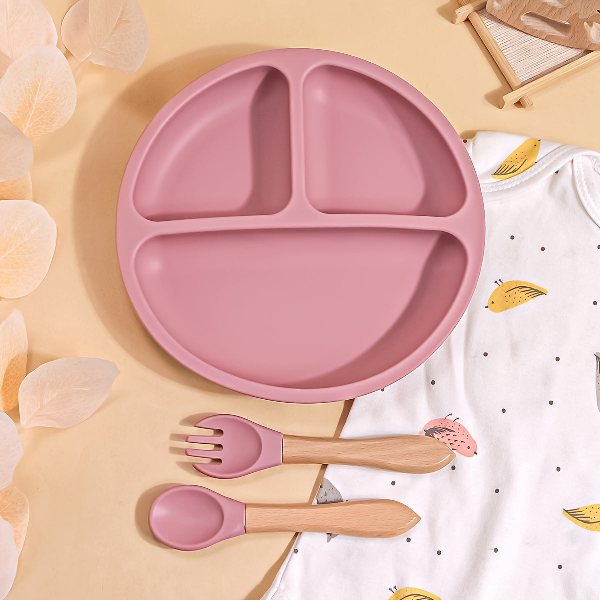 TYRY.HU offers a 3-piece set of baby feeding essentials made from 100% silicone. The set includes a divided suction plate, led weaning set, and plates and utensils set. Perfect for mealtime, this tableware set includes a plate and spoon. Makes a great