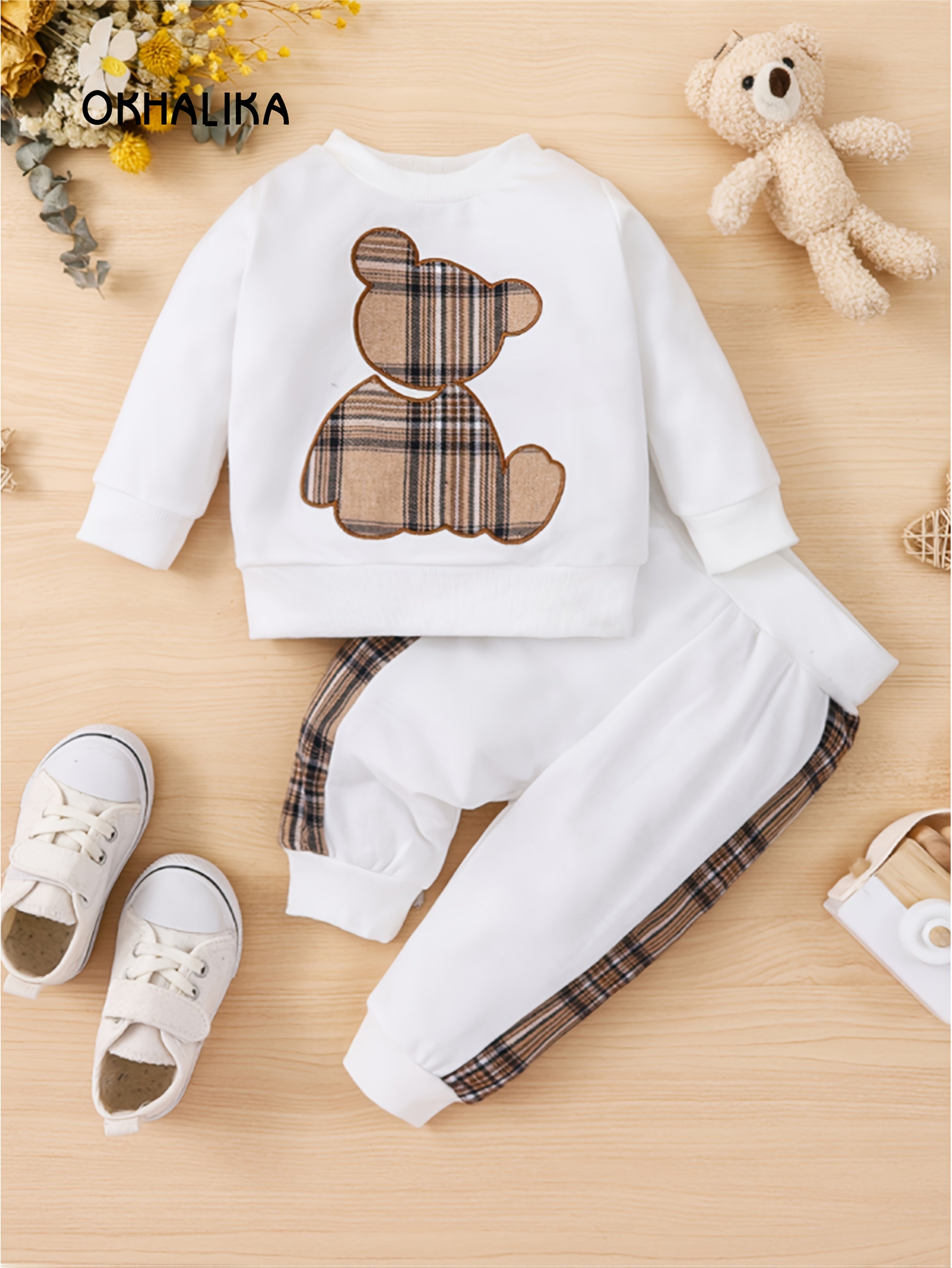 Toddler boy's outdoor fall/winter outfit with long sleeve sweatshirt and casual pants.