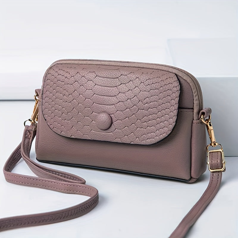 Stylish mini crossbody bag for women with removable strap and zipper closure. Suitable for commuting and shopping.