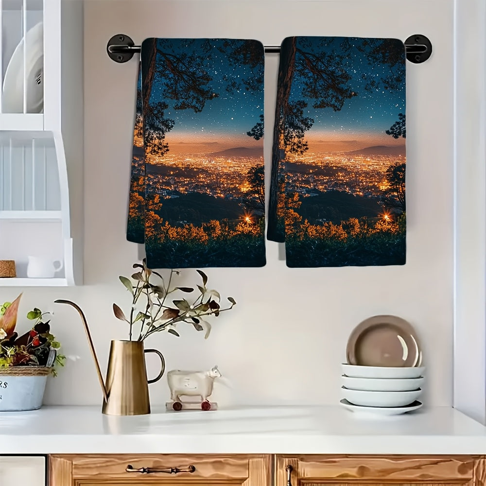 Two Coastal Style Kitchen Towels made of super absorbent polyester knit fabric. These contemporary oblong hand towels feature a sparkling city night view and are machine washable. Each towel measures 40.64x60.96 cm.