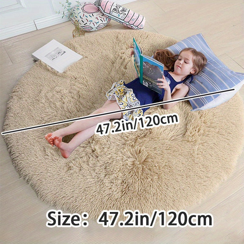 Soft shaggy round rug made of 100% grey polyester. This fluffy area rug is machine washable, fade resistant, and features a low pile tufted weave with PVC backing. Perfect for bedroom, nursery, and kids room decor. Great for gifts on Christmas