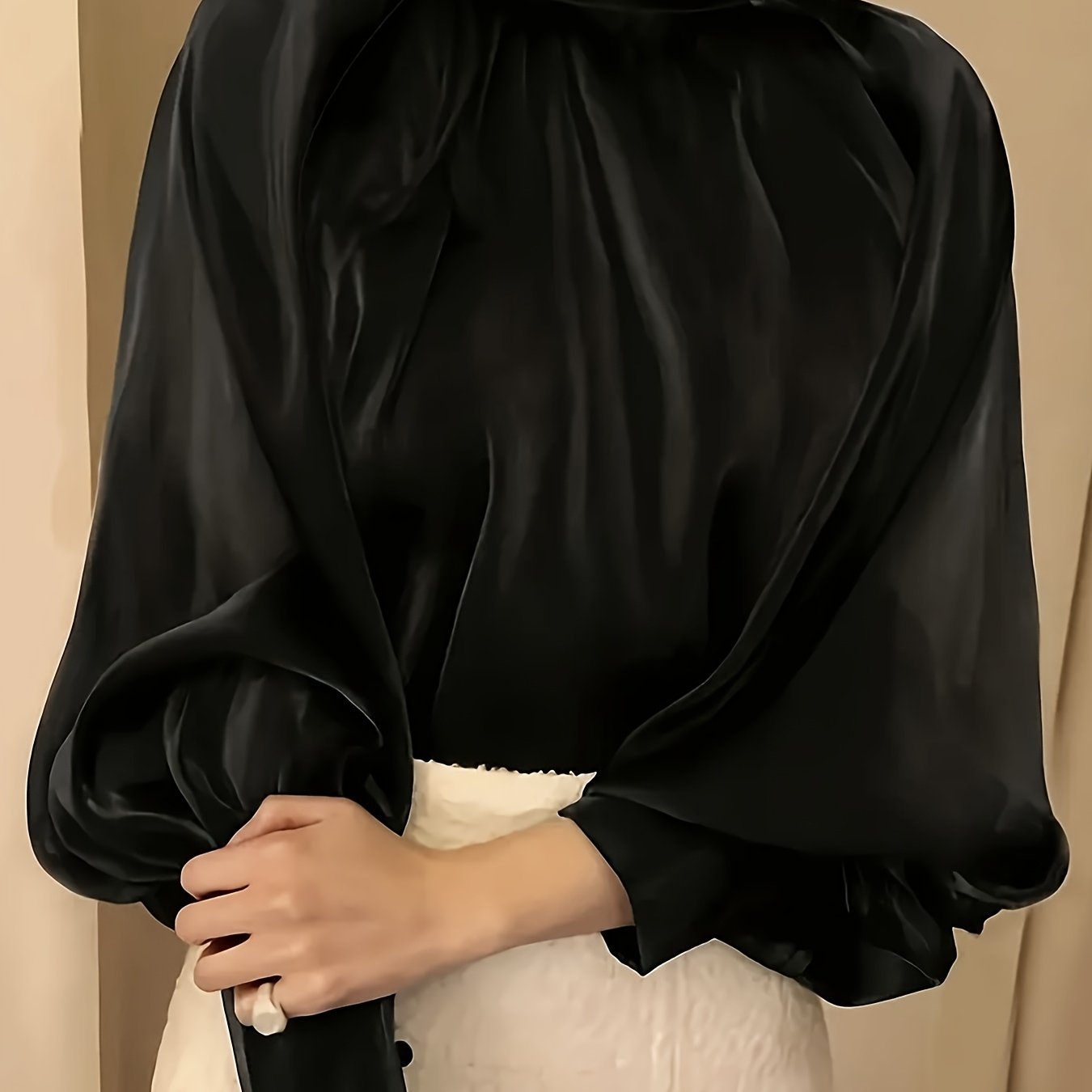 Stylish black satin blouse with lantern sleeves, high neckline, loose fit, and button detail in polyester fabric for women's fashion.