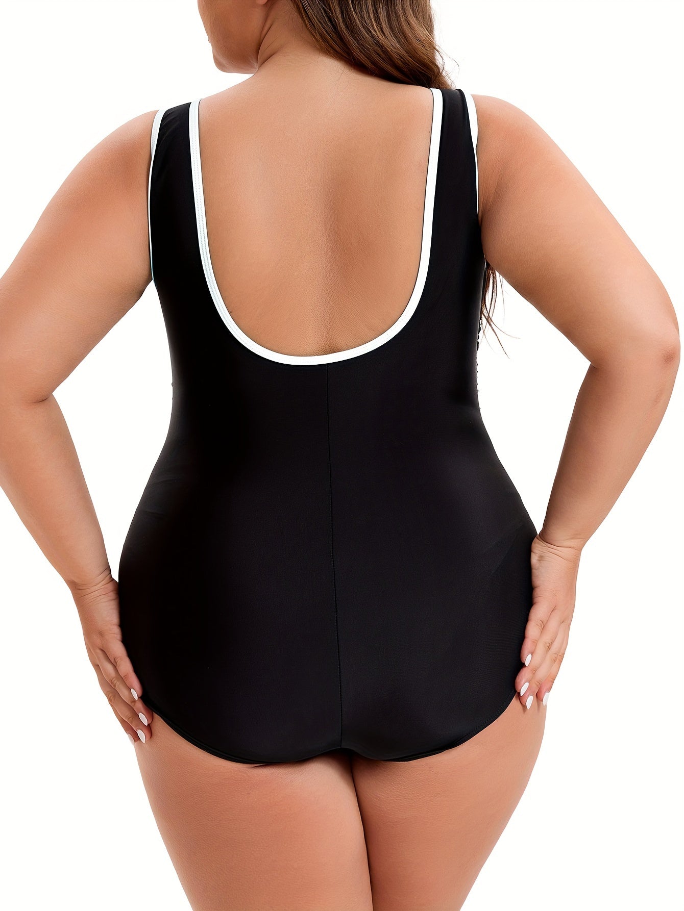 Sporty contrast trim one-piece swimsuit with zipper front, ruched slimming design, for plus size women.