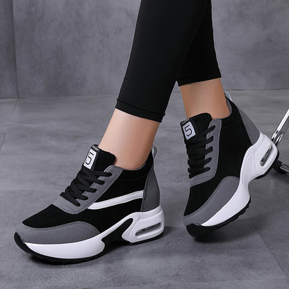 Chunky lace-up sneakers with air cushion for outdoor walks feature hidden heel for added fashion.