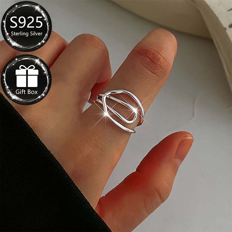 A sophisticated and simplistic adjustable open ring with a hollow line cross design in 925 sterling silver, perfect for everyday or special occasions, suitable for men and women.