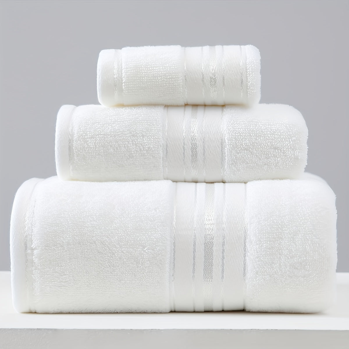 3-piece cotton towel set includes a washcloth, hand towel, and bath towel. Absorbent, quick-drying, super soft, and skin-friendly. Ideal for home bathroom use.