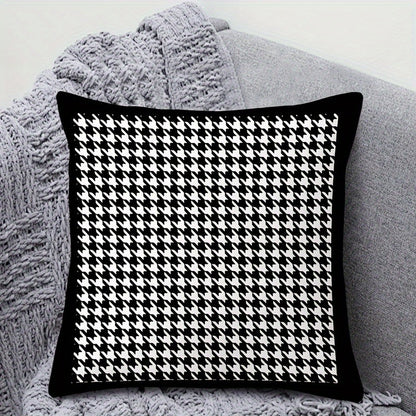 This reversible Contemporary Houndstooth Throw Pillow Cover measures 44.96cm and features a zipper closure. Made of woven polyester, this machine washable cushion case is perfect for living room decor. The black and white design adds a modern touch and