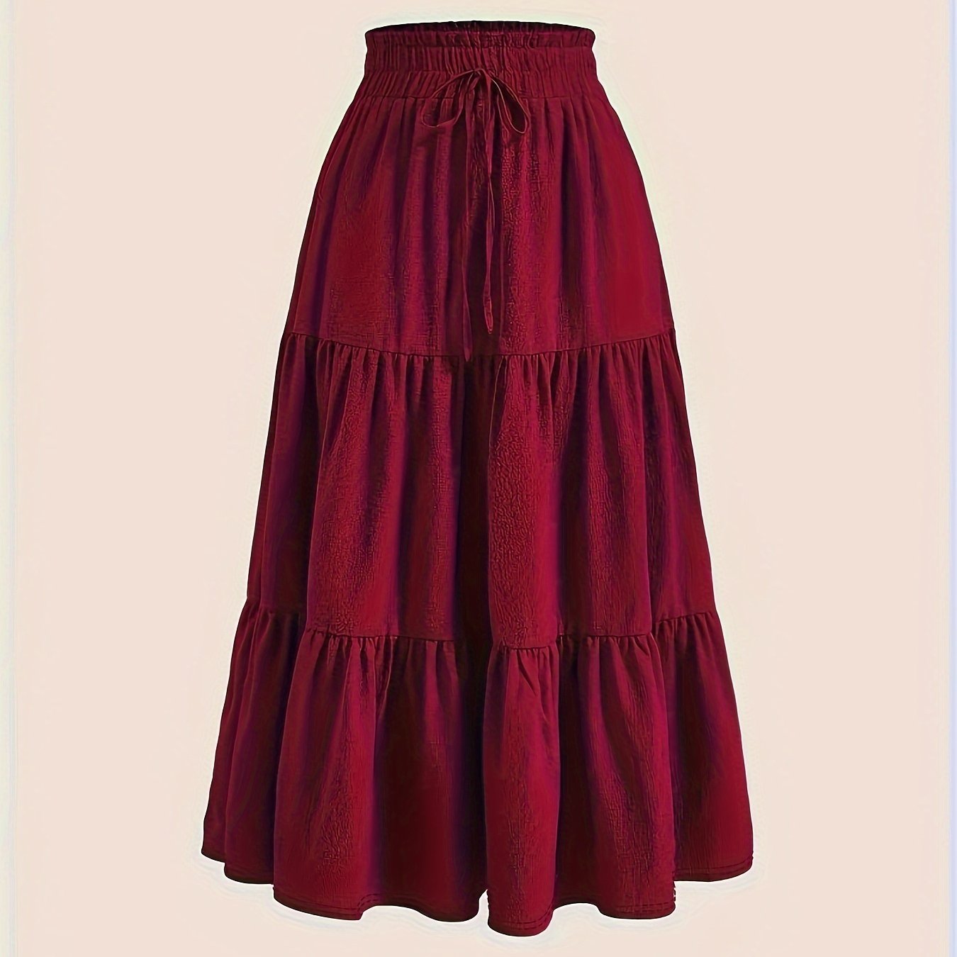 High-waisted maxi skirt with ruffled hem, made of polyester blend, perfect for casual wear in spring, summer, and autumn, machine washable.