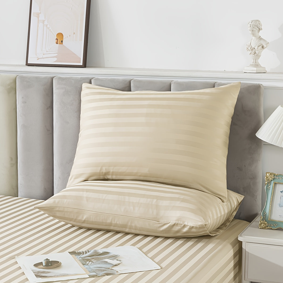 Pillowcase made with luxurious satin stripes, providing a soft, breathable, and durable option for both home and hotel use. Features envelope closure and is recommended for dry clean only. Available in white and khaki colors.