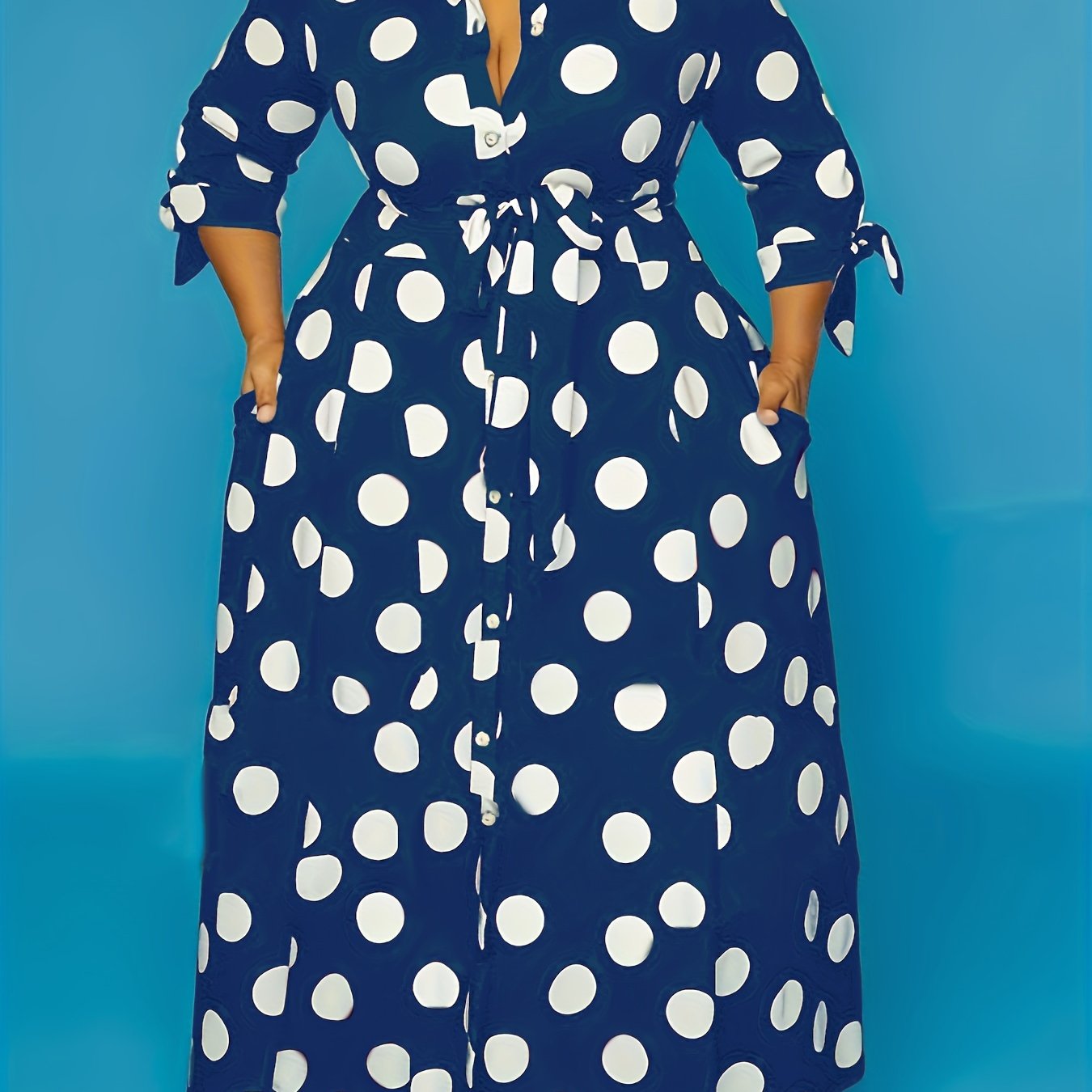 Women's plus size polka dot print maxi dress with collared button-up front and belted waist.