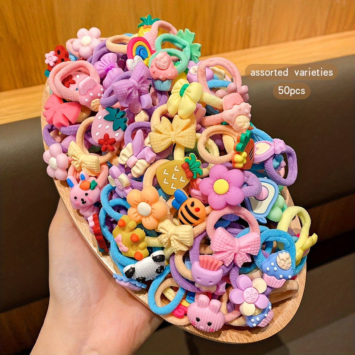 50 cute cartoon styles of randomly assorted rubber bands; sweet and stylish hair accessories for daily use.