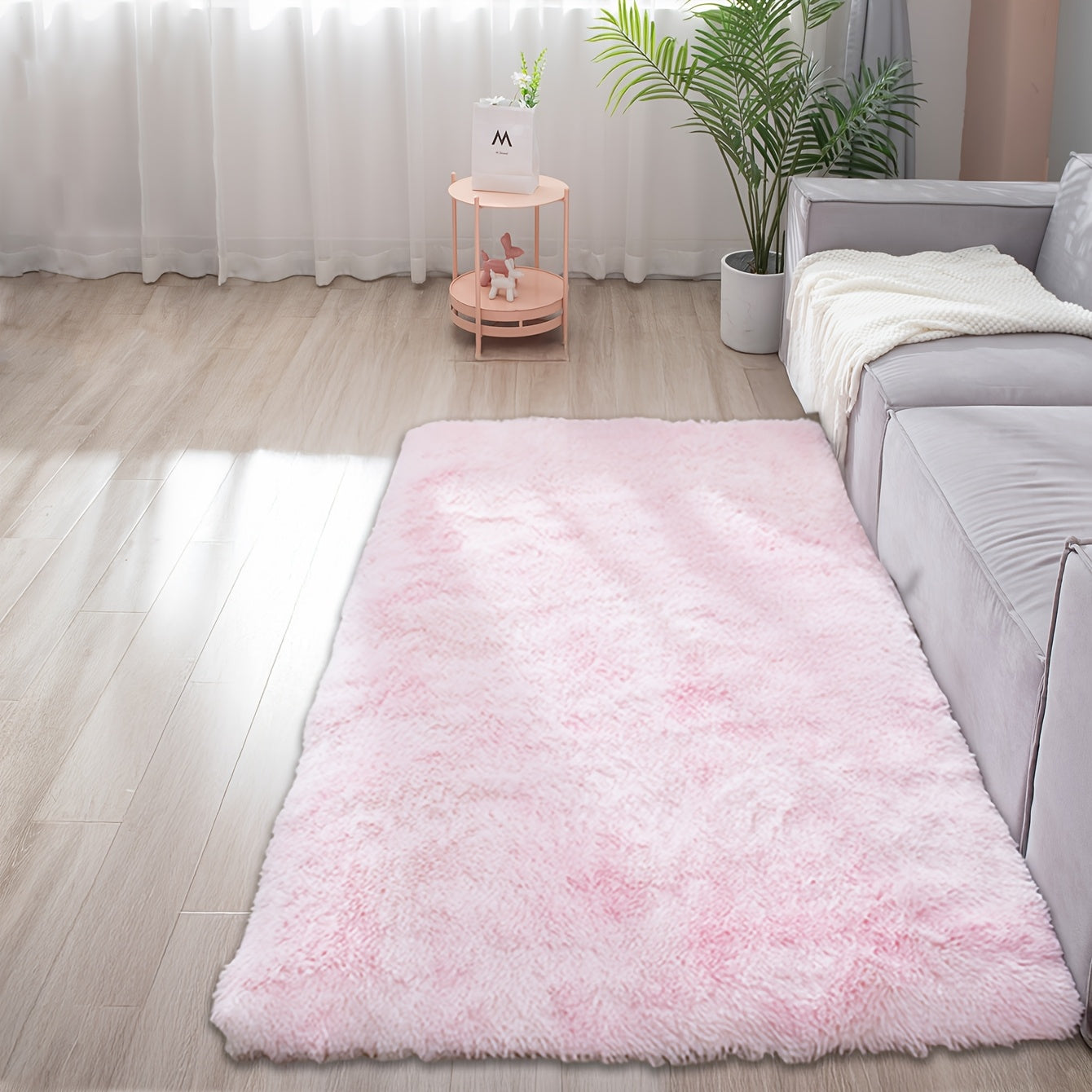 Soft and fluffy rectangle area rug perfect for your bedroom. This plush carpet is thick and non-slip, making it ideal for your living room. Made with machine-made polyester fiber, this low-pile rug is washable for easy cleaning. Perfect for indoor use.