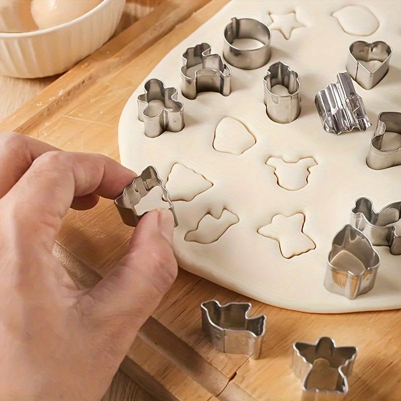 Set of 20 miniature Christmas cookie cutters made of stainless steel featuring Santa, reindeer, and snowman shapes. These baking molds are safe to use with food and perfect for making festive treats and holiday snacks.