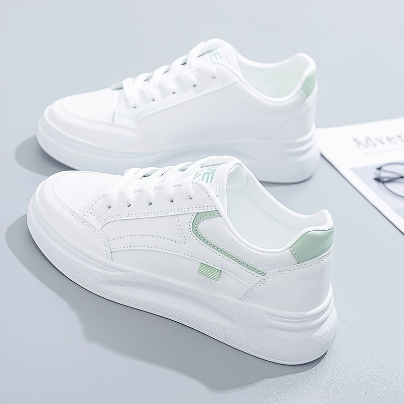 Stylish white sneakers with green accents for casual wear, lightweight and breathable.