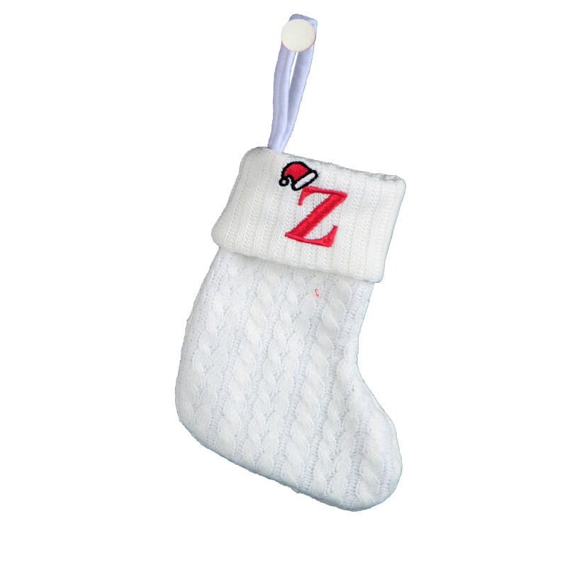 White cable knit stocking with embroidered 'F' - Ideal for indoor decor.