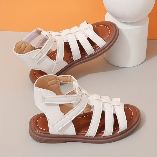 Ivory sandals for girls with brown sole, ideal for school and leisure activities.