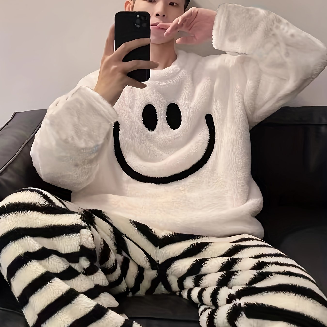 Men's casual style cartoon embroidered pajama set with long sleeve crew neck top and regular fit pants. Made with warm fleece fabric for fall/winter sleepwear.