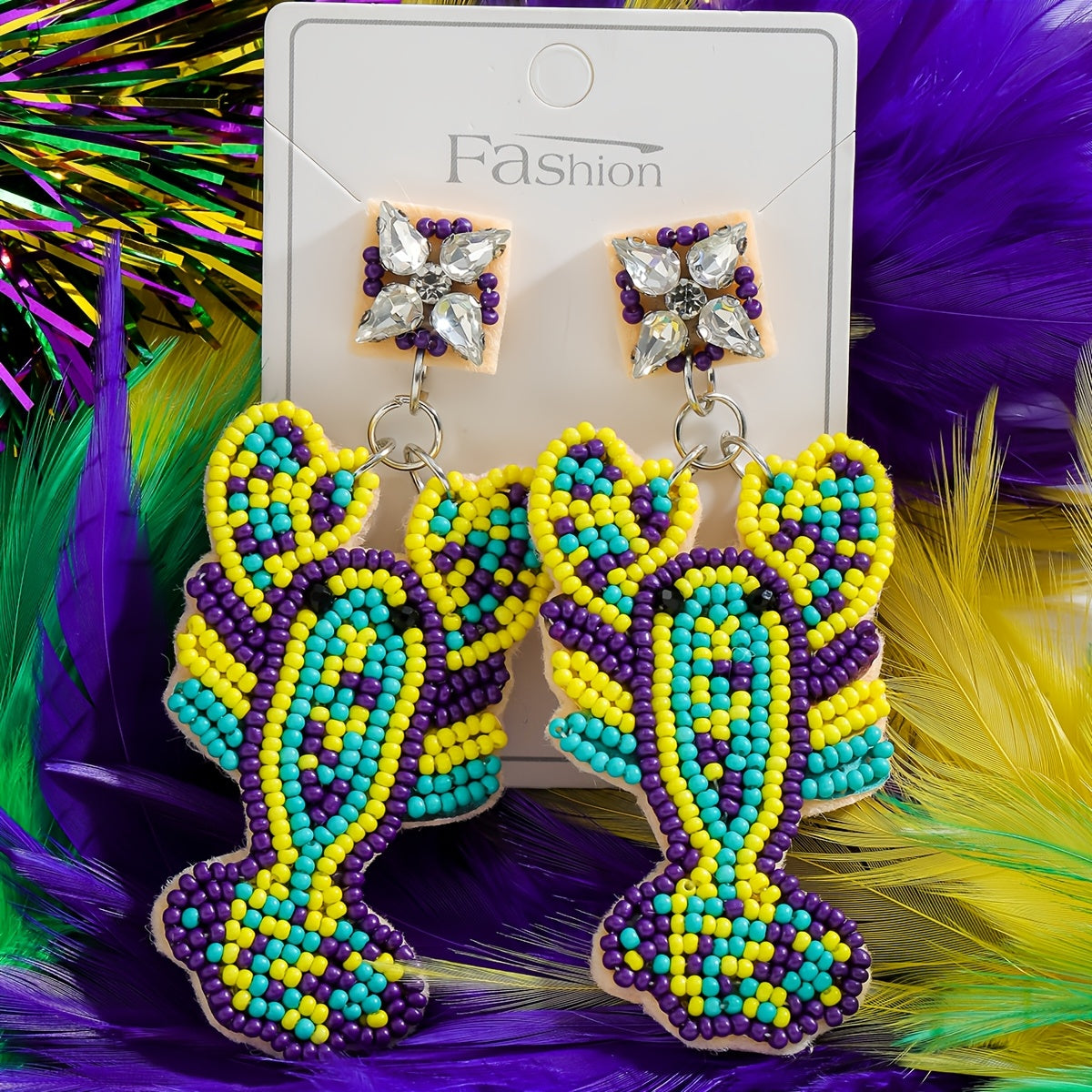 Mermaid-inspired beaded earrings with a Boho twist, adorned with colorful beads and rhinestones. Featuring a lobster claw design and stainless steel posts, these festive Mardi Gras earrings are perfect for daily wear or party occasions year-round.