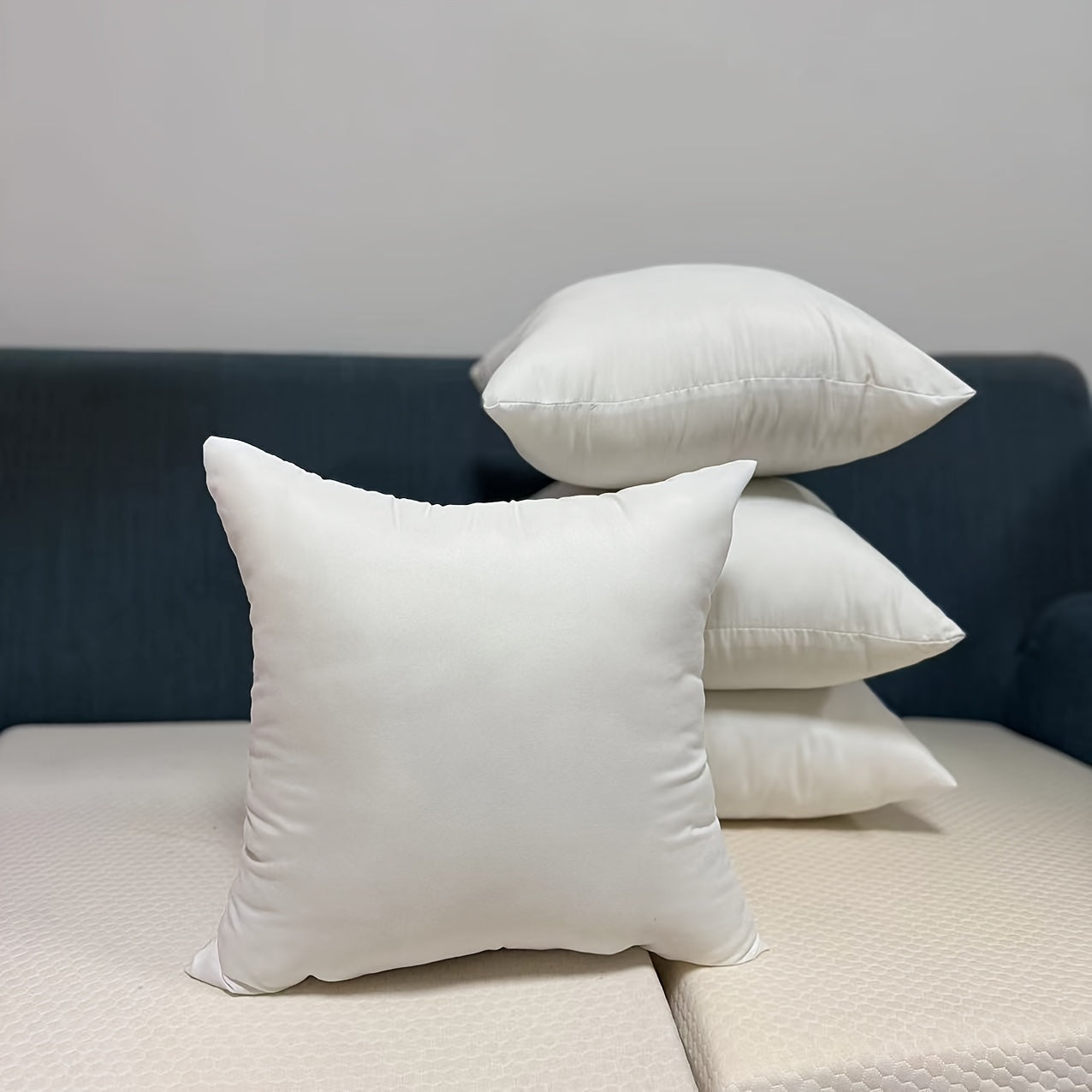 Set of four traditional white throw pillow inserts, featuring high resilience for a comfortable and stylish addition to your sofa, car, or bedroom décor