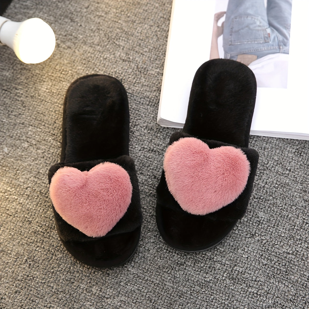 Warm and cozy women's plush slippers with heart accent for indoor comfort and style.