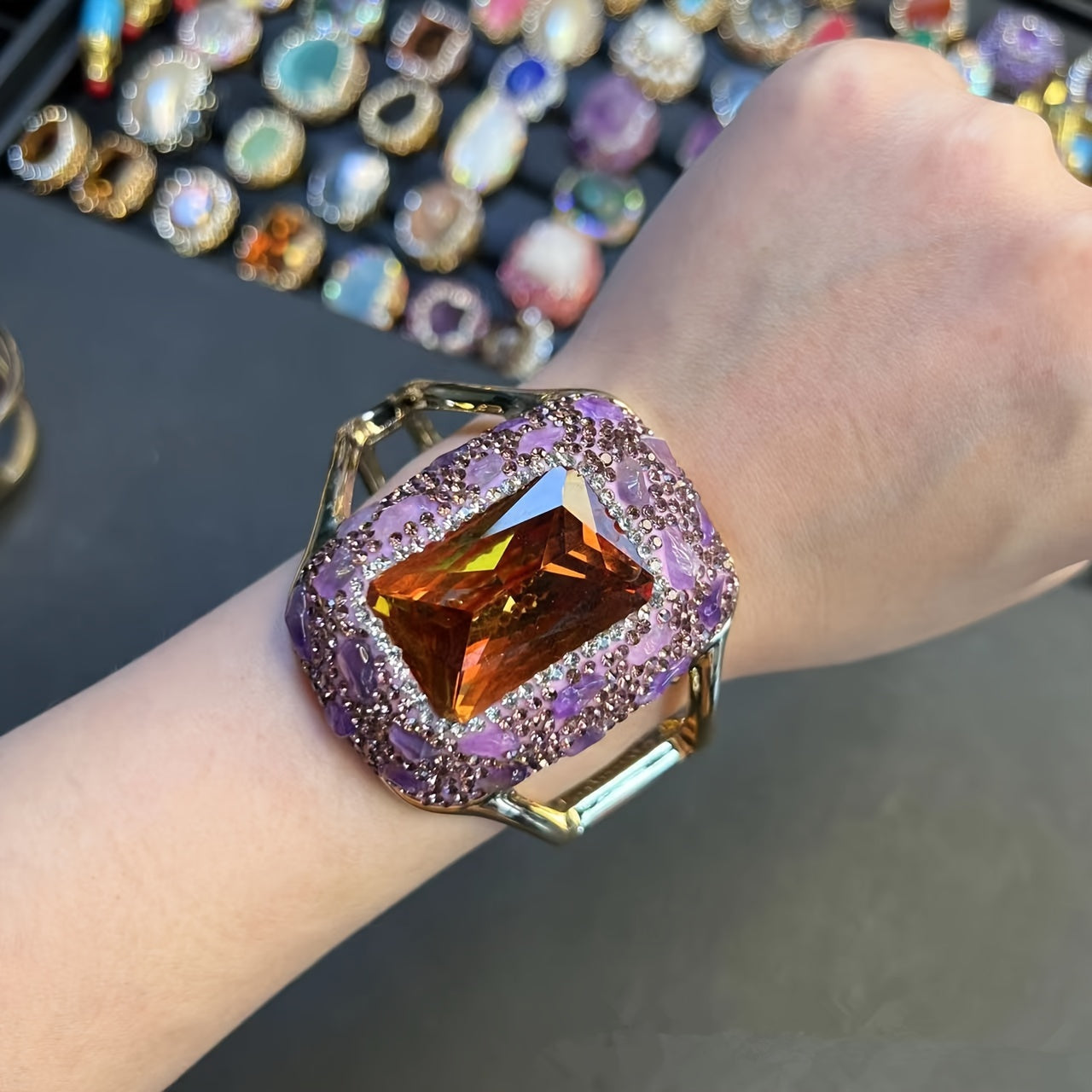 Add some sparkle to your outfit with this stunning Glitter Style Women's Cuff Bracelet! Featuring Rhinestone Accents and a Copper Base, its Large Open Design is sure to make a statement at parties and banquets. Get ready to shine with this Blingbling