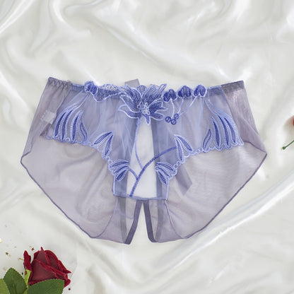 Women's light purple lace mesh panties with floral embroidery feature an open crotch and breathable, sheer design made from a nylon and elastane blend that is hand washable.