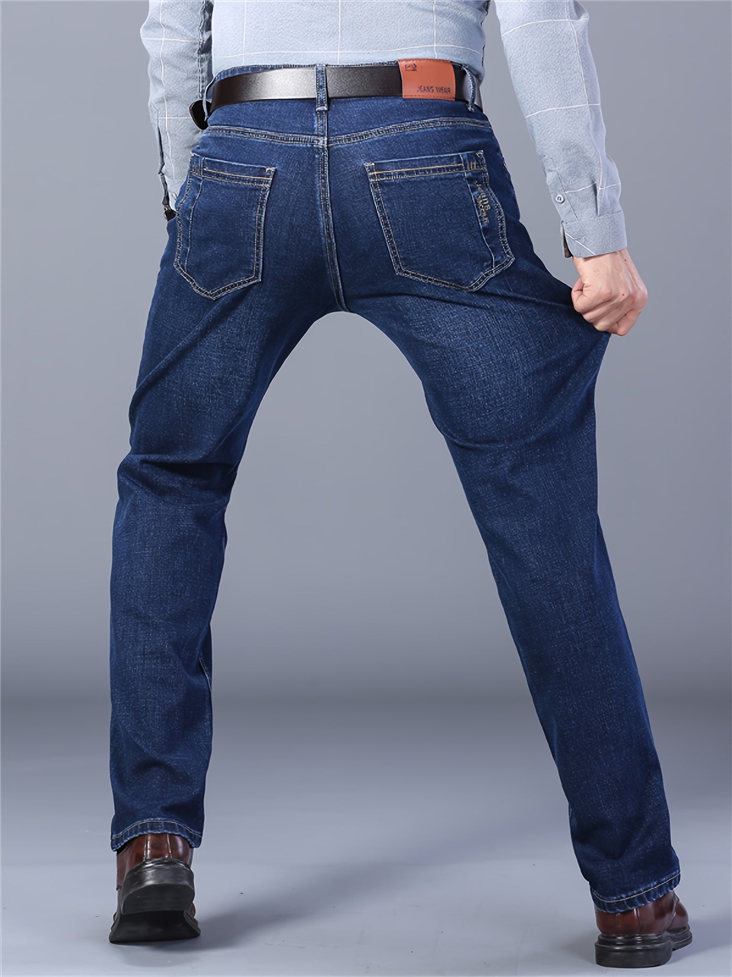 Men's casual cotton blend jeans with pockets, ideal for outdoor activities.