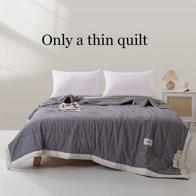 Ultra-soft lightweight summer quilt with cooling bean paste design for bedroom and guest room comfort, machine washable.