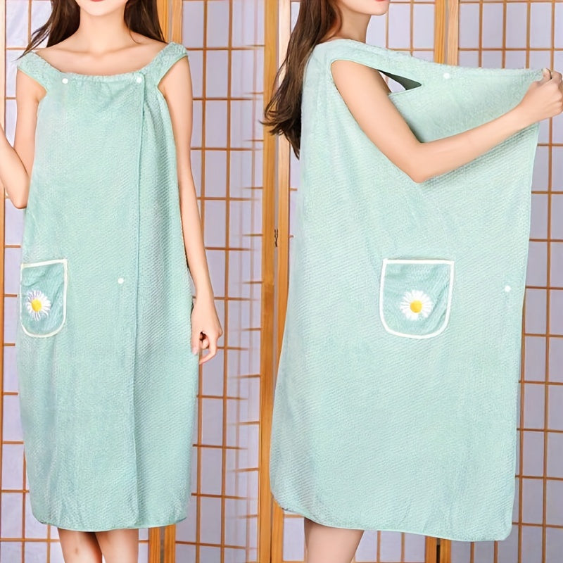 Adults' wearable bath towel features pockets, buttons, and quick-drying, absorbent material. Perfect for home spa or sauna use.