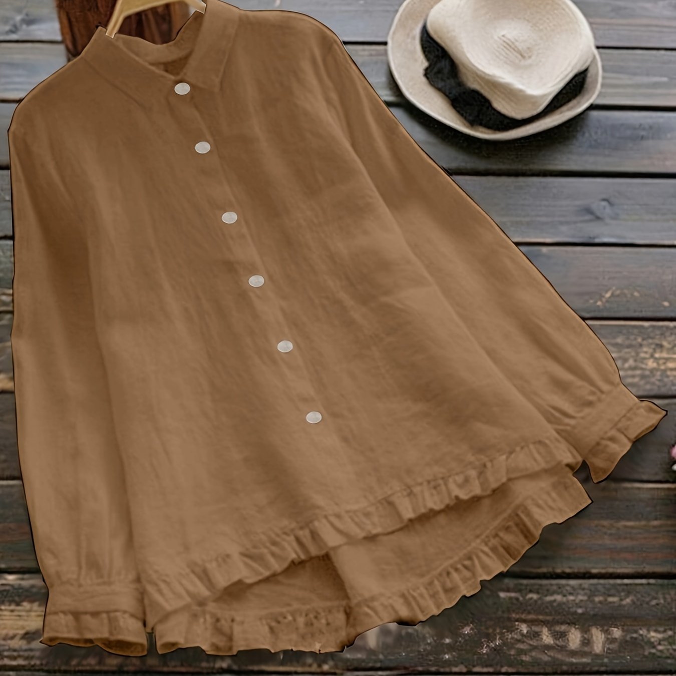 Loose-fitting collared shirt in solid color with front buttons and lace trim.