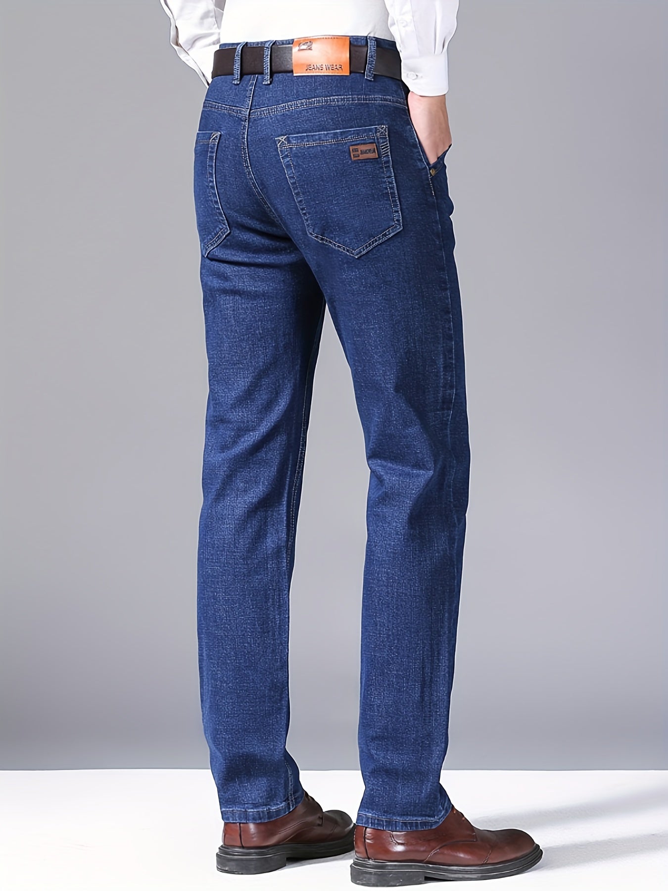 High-quality business casual denim pants for men, featuring a stretch comfort fit in a solid color washed finish. Made with all-season woven fabric of 65% cotton, 33.7% polyester, and 1.3%