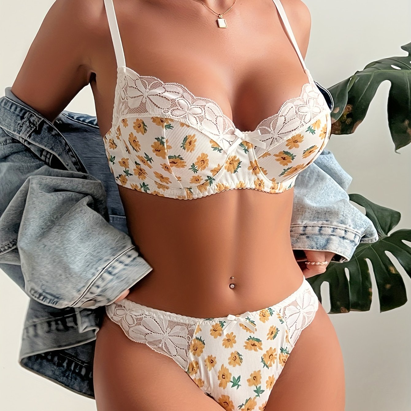 Stylish lace-trimmed bra and panty set for women in a comfortable, non-transparent polyester blend with a random print design.