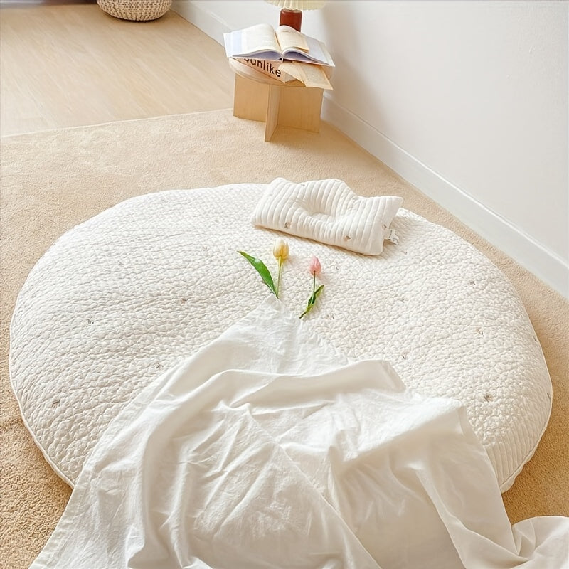 Circular crawling mat made of breathable cotton, perfect for both playtime and room decoration. This soft and plush mat is removable and washable, with intricate embroidery for added style.