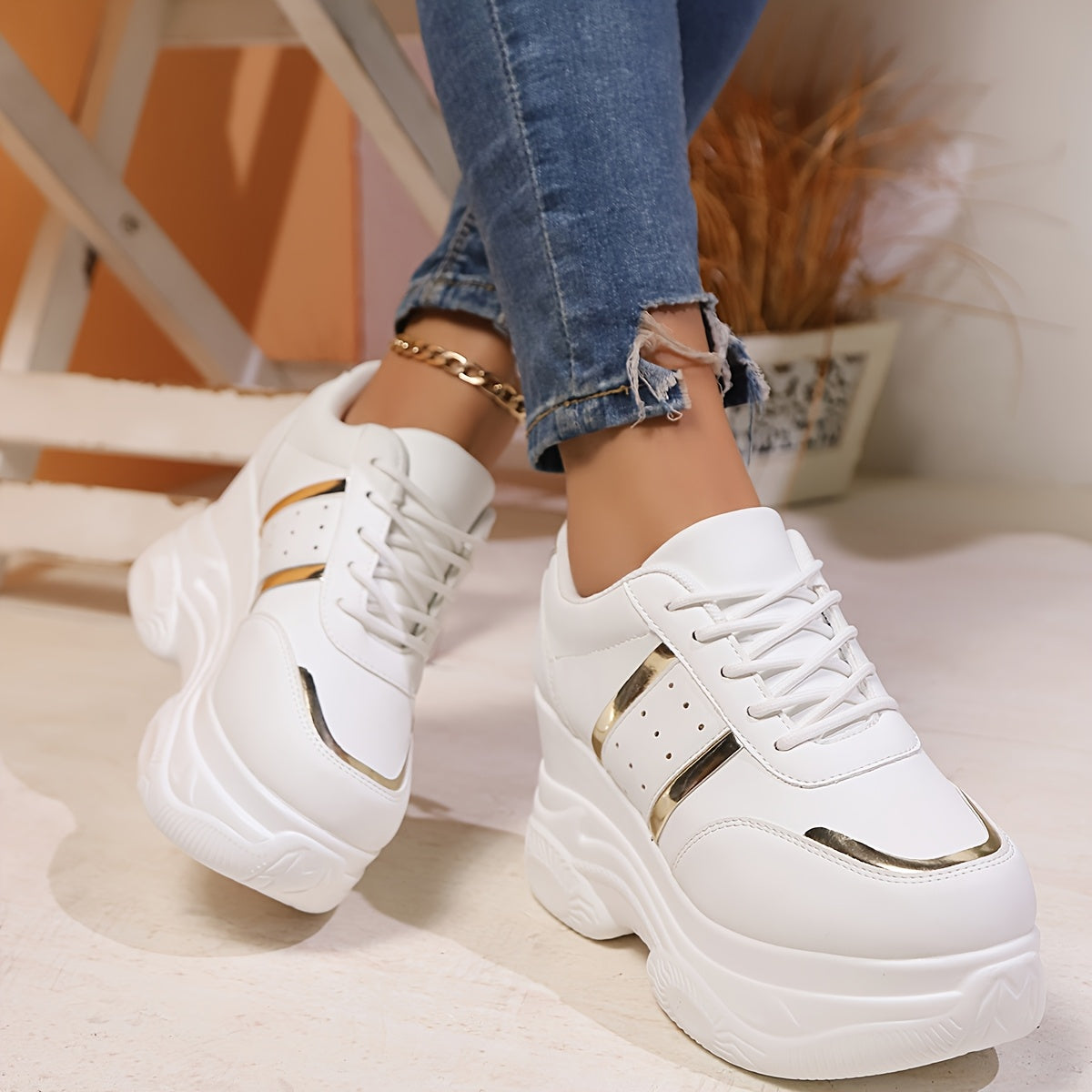 Gold-trimmed lace-up height-increasing casual sports shoes for women.