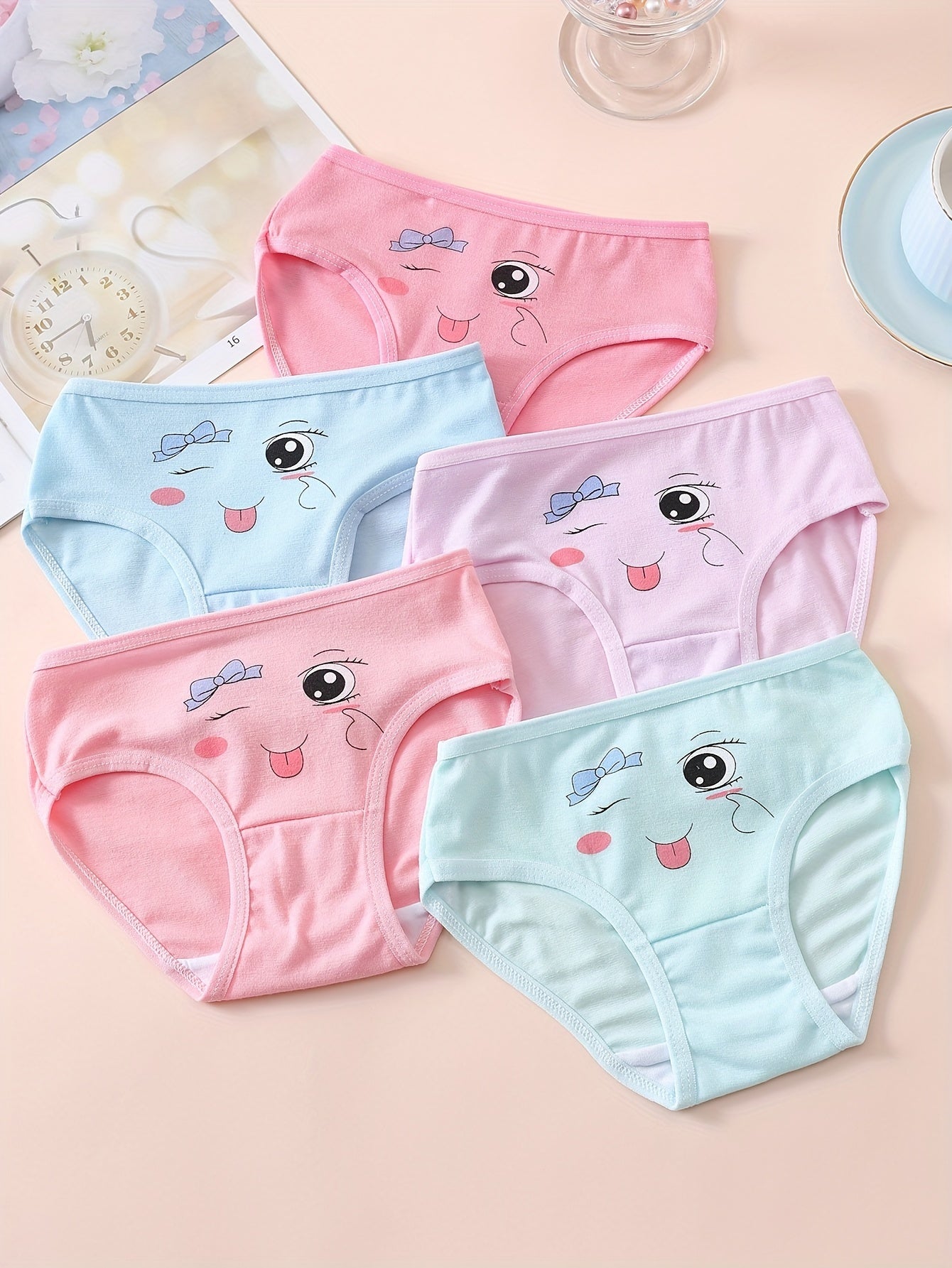 10 pieces of girls' soft and comfortable cotton briefs with cute patterns and breathable fabric.