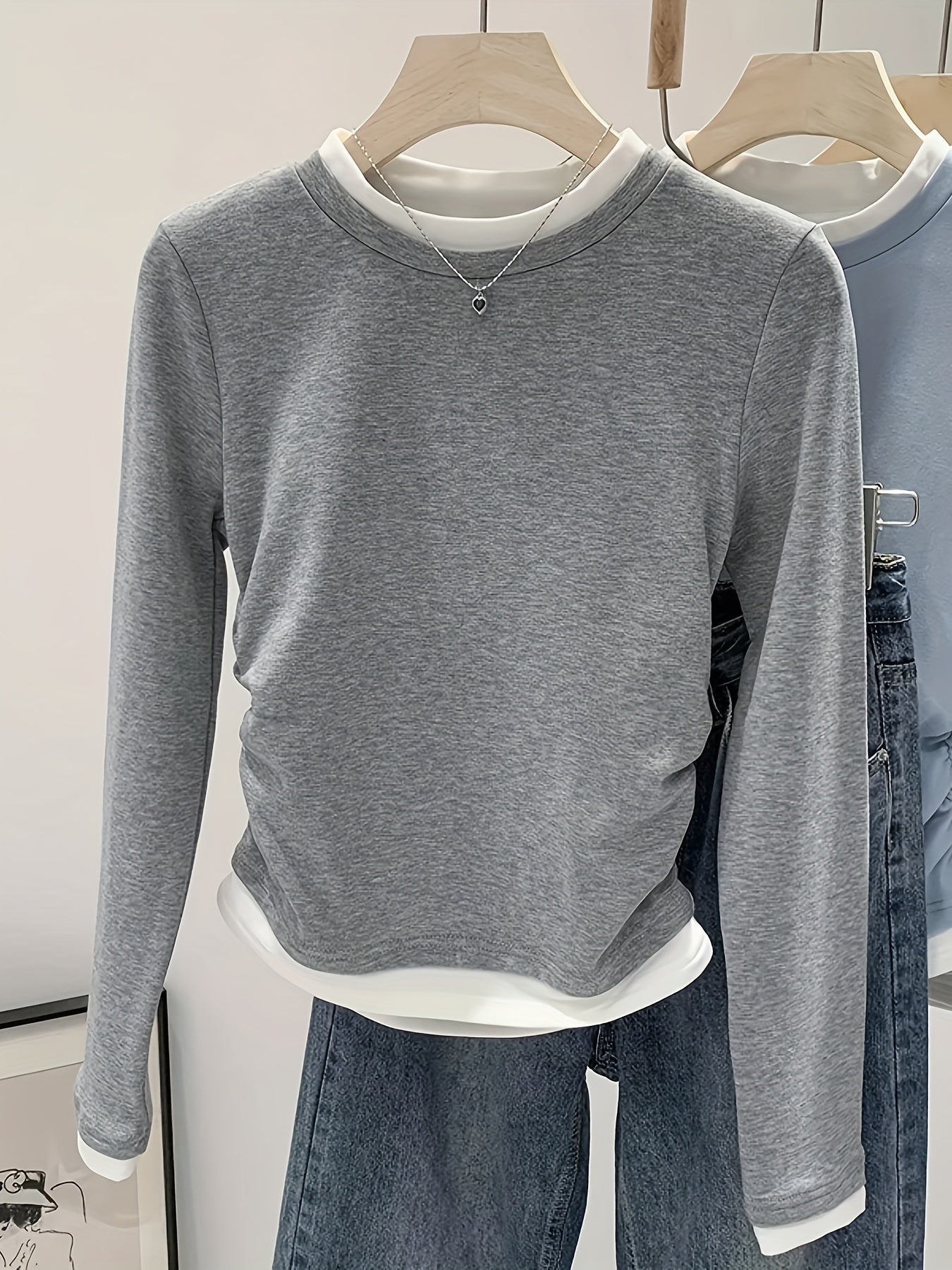 Women's slim fit knit T-shirt with ruched detail and contrast collar, suitable for all seasons.