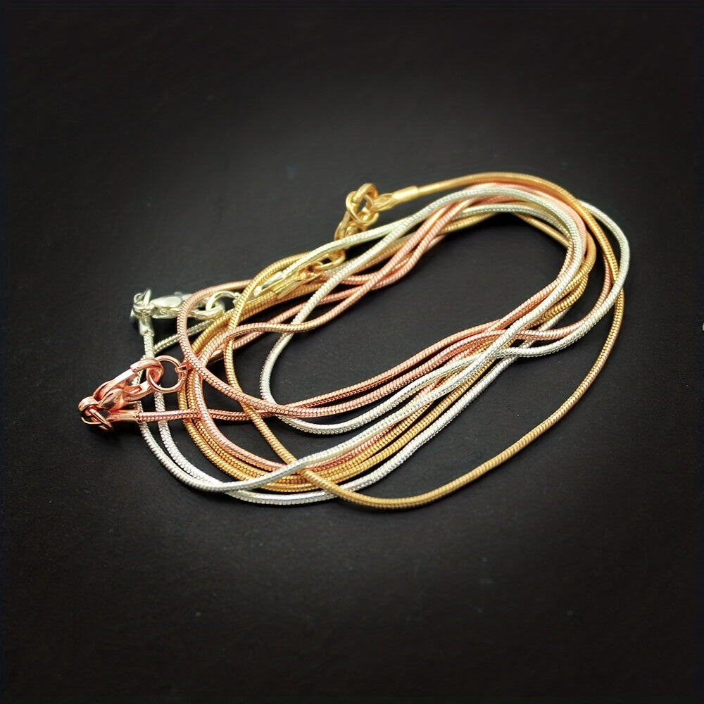 10 pieces of snake chains in Rose Gold, Gold, and Rhodium plating, ranging from 16 to 30 inches in length. Each chain comes with a lobster clasp and is perfect for creating custom jewelry pieces. Great for DIY crafting and jewelry making supplies.