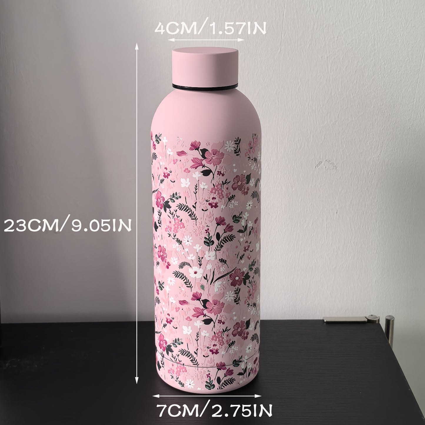 Stylish 16.9oz insulated water bottle with chic pink floral design, perfect for travel, sports, and everyday use. Great gift for birthdays and holidays.