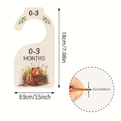 8 wooden closet dividers featuring cute animal themes for organizing clothes in a wardrobe for 24 months.