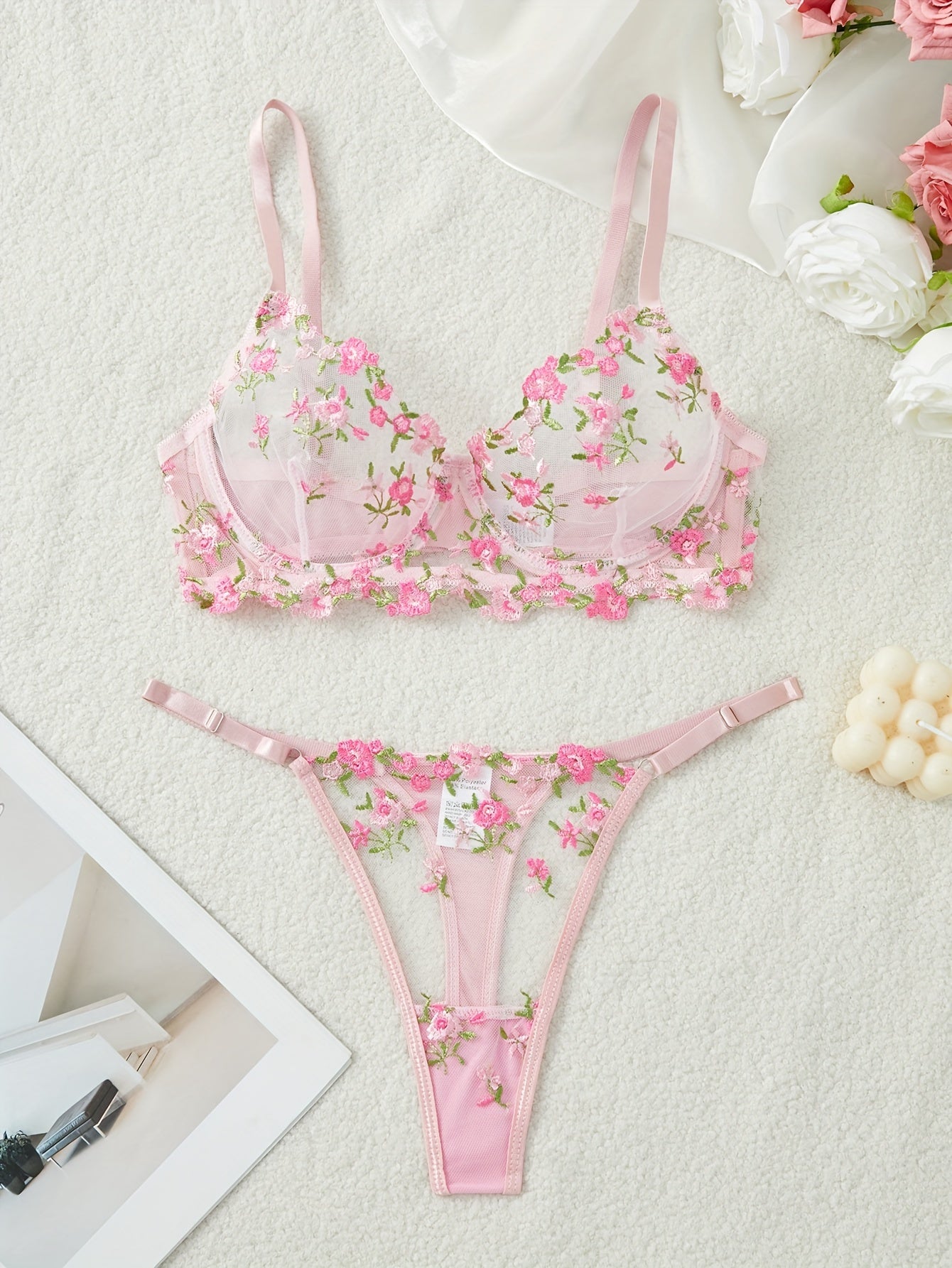 Floral embroidered lingerie set with semi-sheer mesh bra and thong for women.